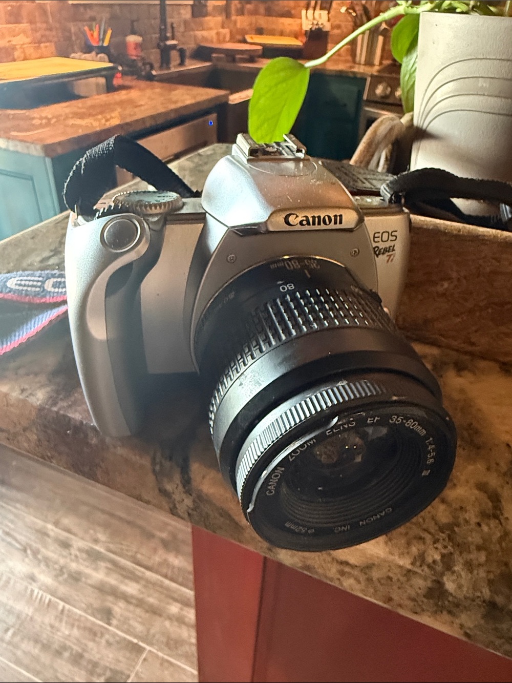 Canon Silver and Black EOS Rebel with 35-80mm Lens